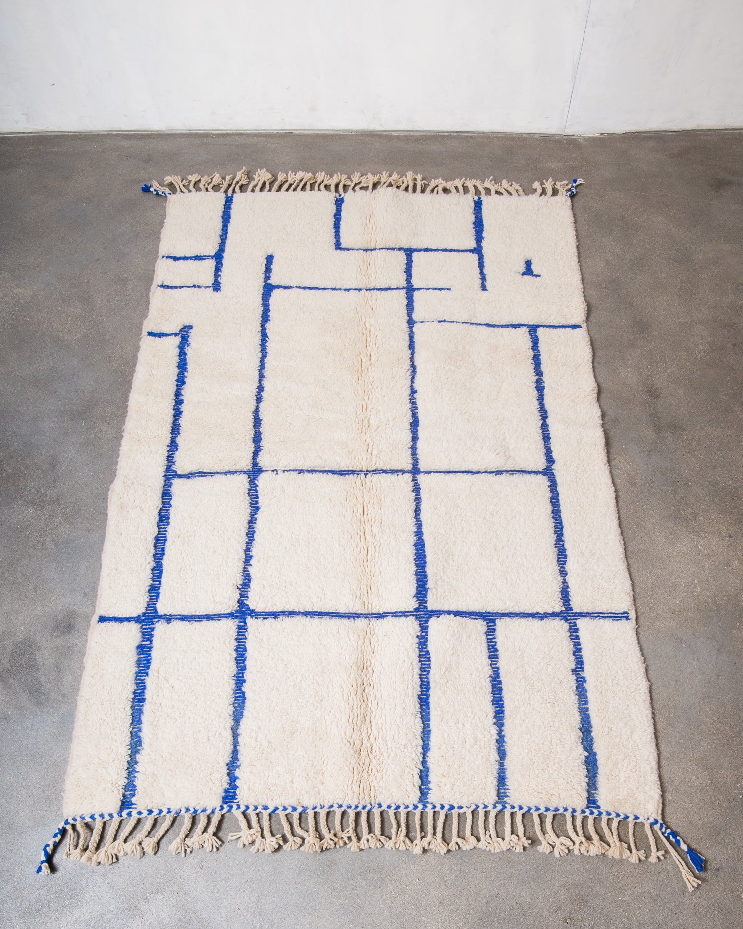 Modern, designer, handcrafted Berber rug from Morocco. Beniourain carpet with minimalist design, natural wool pile and a fluffy texture.